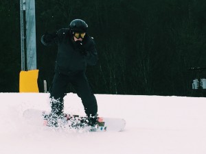 Alan Gutman snowboarding in the snowy mountains of North Carolina.